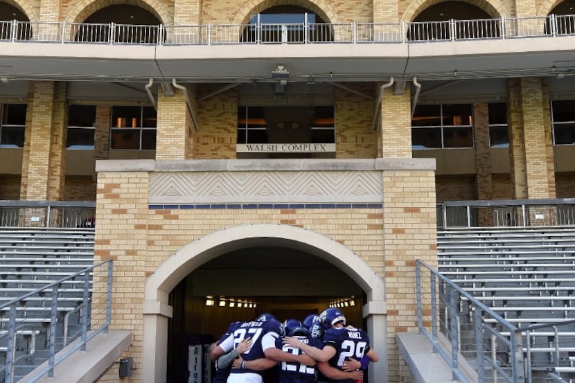 Texas Christian's kicking team huddles in the tunnel entrance way before taking the field...