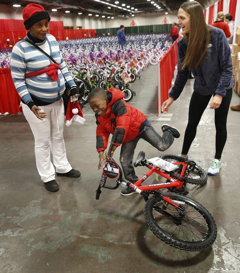 
Six-year-old Dominique Bamanga was a little too short for the bike he tried out. He was...