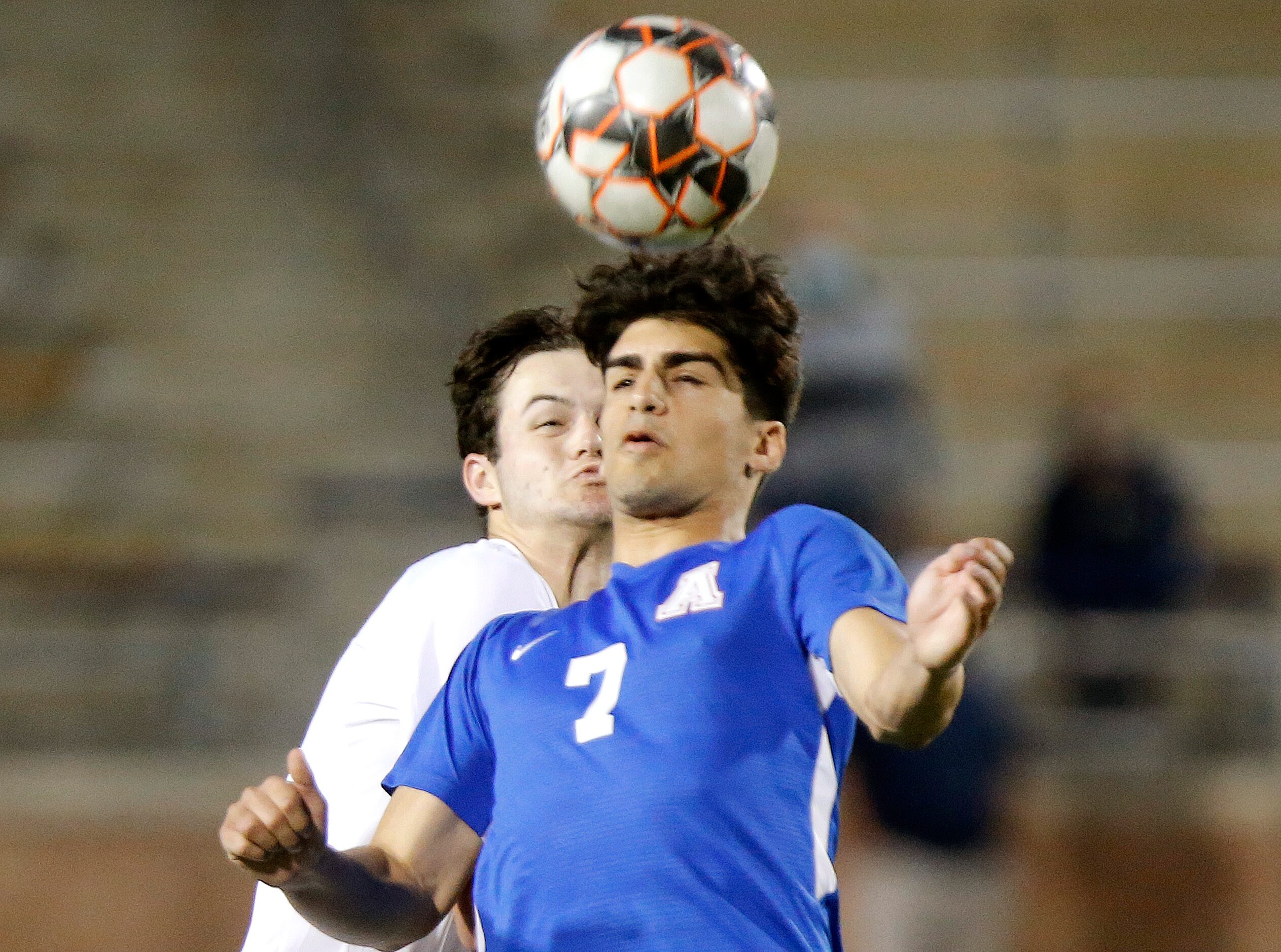 Allen forward Emon Ghiasi (7) gets  header during the second half as Allen High School...