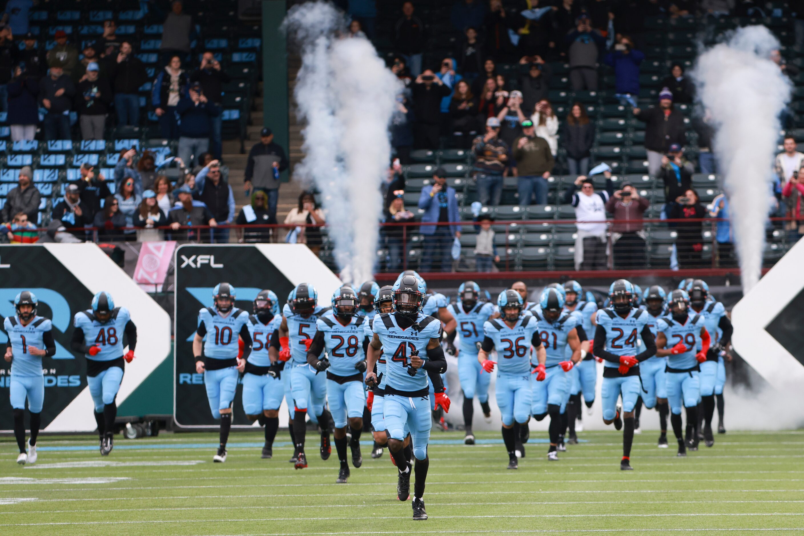 The Arlington Renegades run onto the field before an XFL football against the Vegas Vipers...