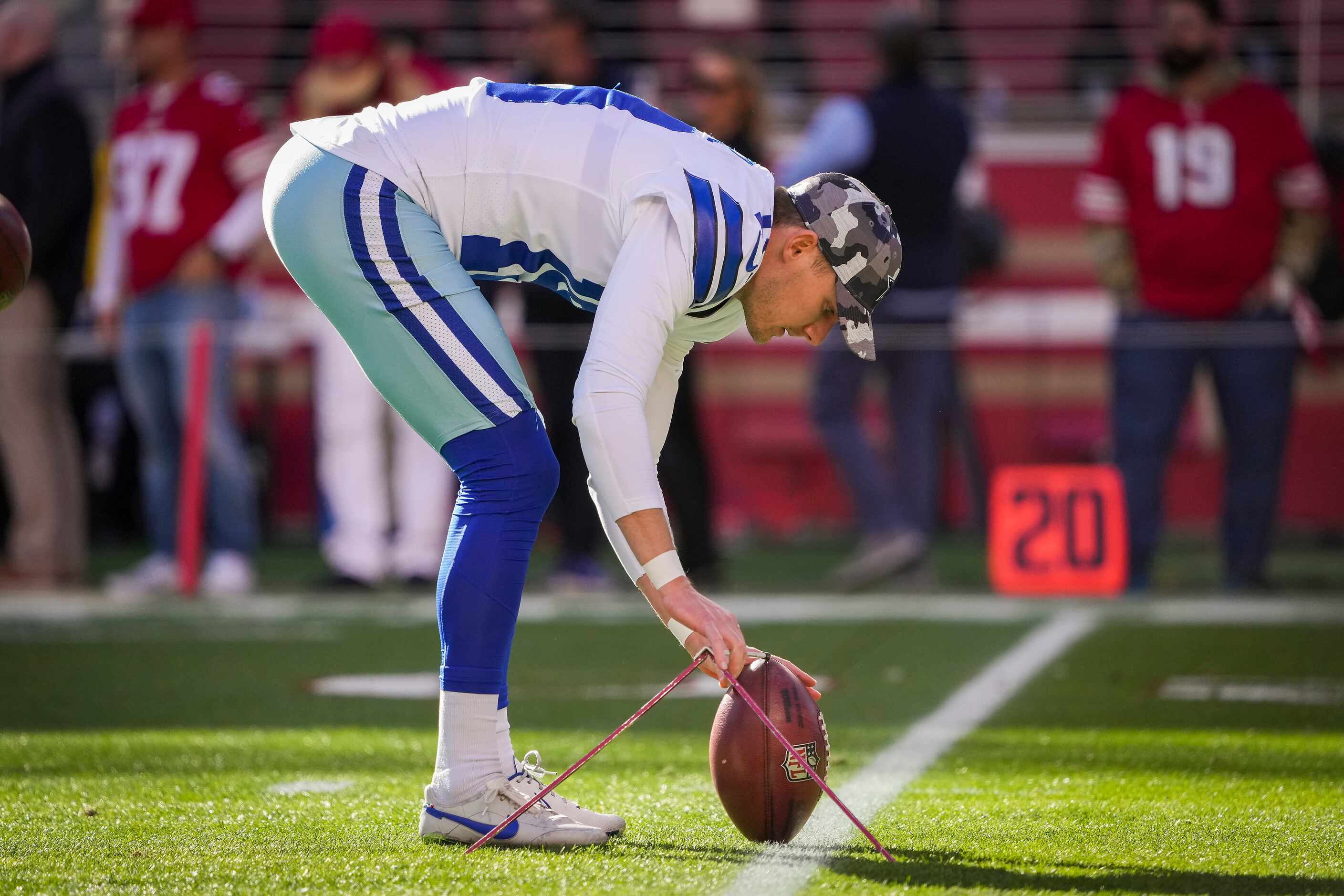 Dallas Cowboys place kicker Brett Maher warms up before an NFL divisional round playoff...