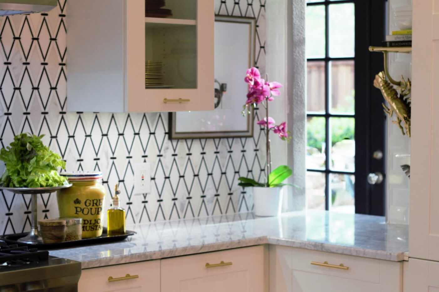 A bold diamond pattern helped transform a kitchen designed by Elaine Williamson-Romero.