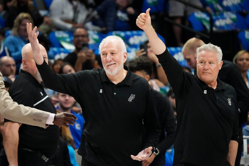 San Antonio Spurs head coach Gregg Popovich motions to Dallas Mavericks coach Jason Kidd...