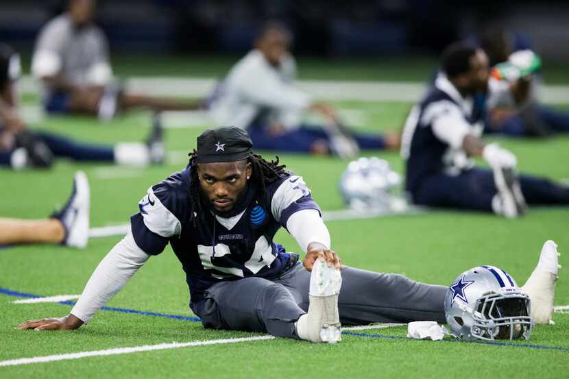 Dallas Cowboys middle linebacker Jaylon Smith (54) stretches during a Dallas Cowboys OTA...