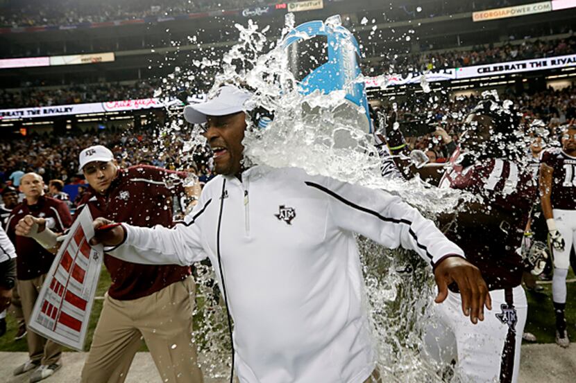 In what was one of the last images made by Dave Martin, Texas A&M coach Kevin Sumlin is...