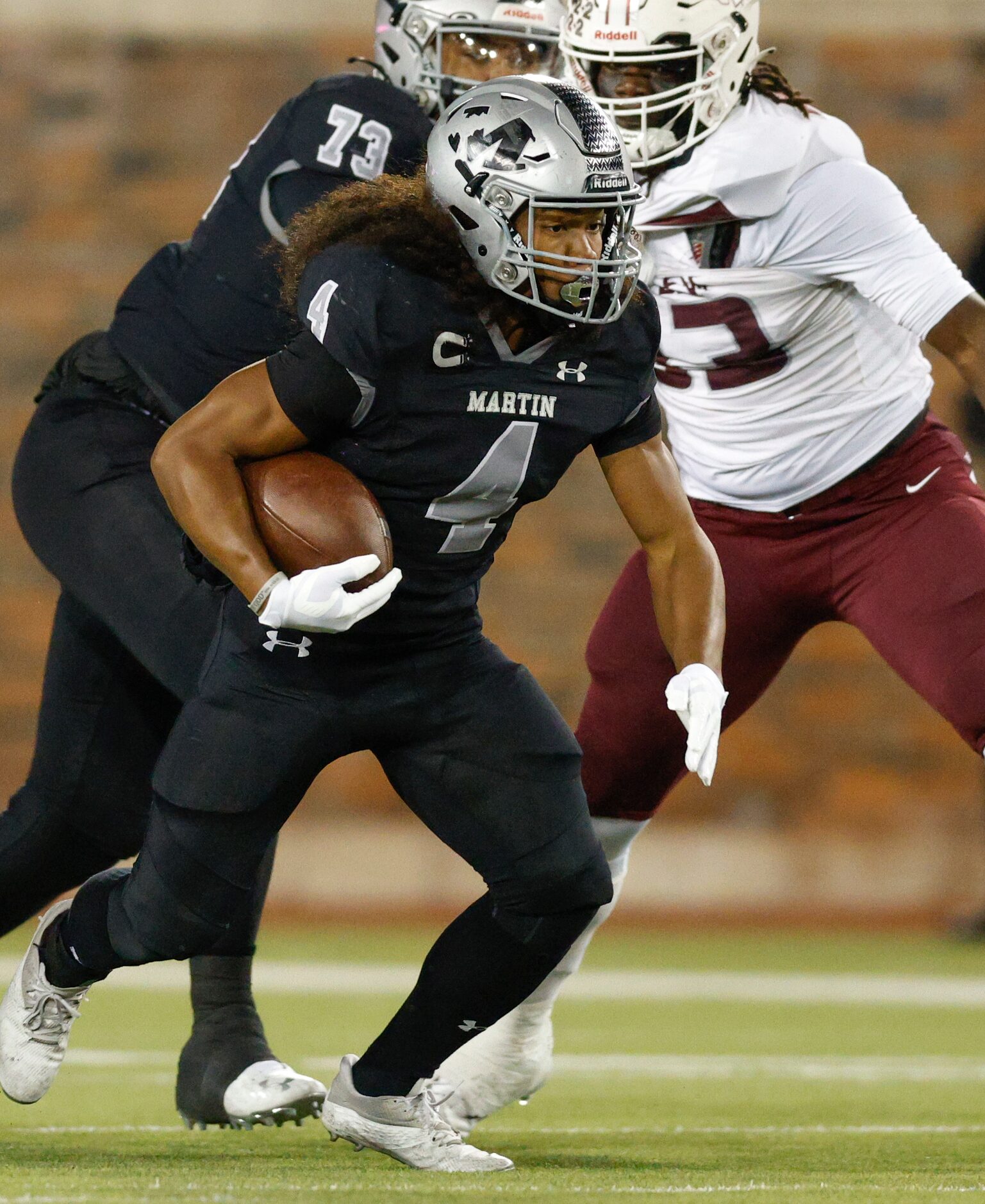 Arlington Martin wide receiver Michael Barrow (4) runs the ball during the first half of a...