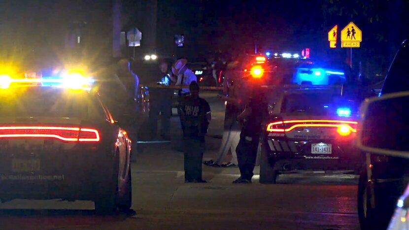 Dallas Police officers and Department of Public Safety troopers met outside of a house on...