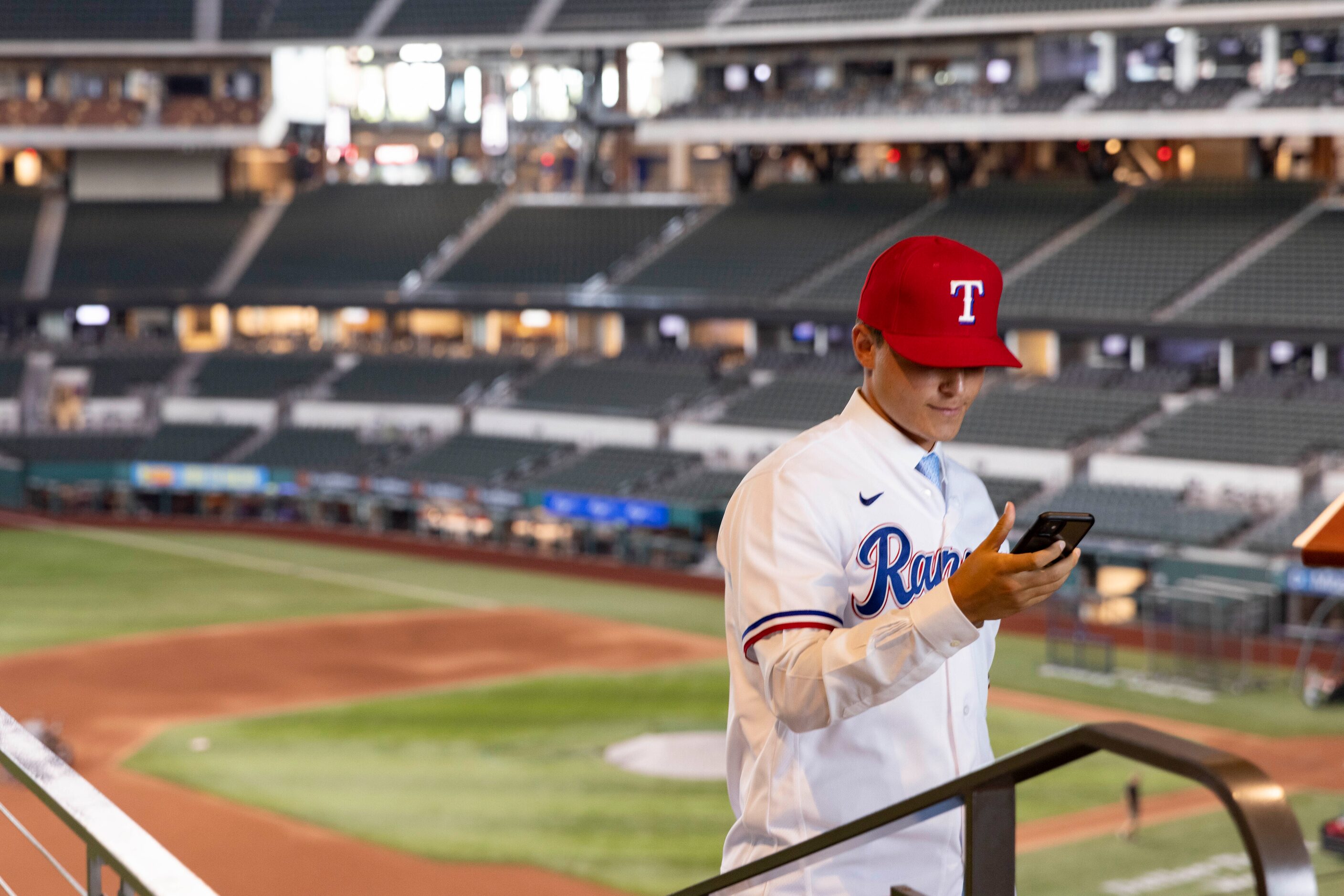 Jack Leiter (left) from Vanderbilt University looks at a selfie he took following a press...