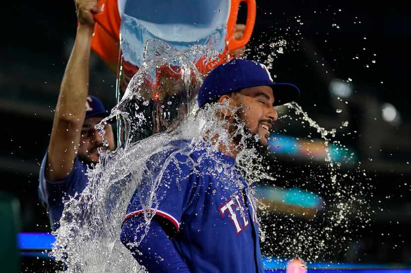 Texas Rangers relief pitcher Grant Anderson is doused after the baseball game against the...