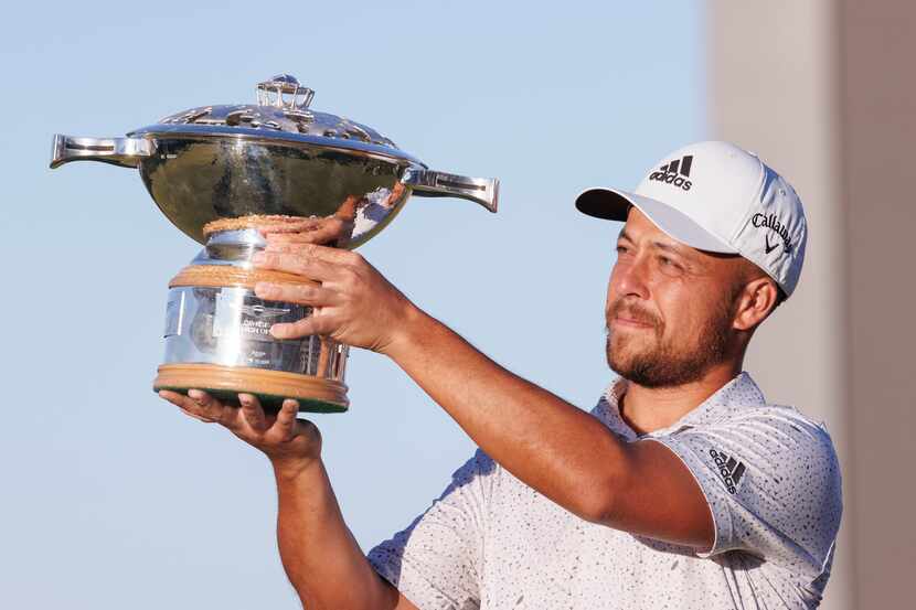 Xander Schauffele holds the trophy after winning the Genesis Scottish Open at The...