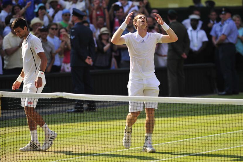 Britain's Andy Murray (R) celebrates beating Serbia's Novak Djokovic (L) during the men's...