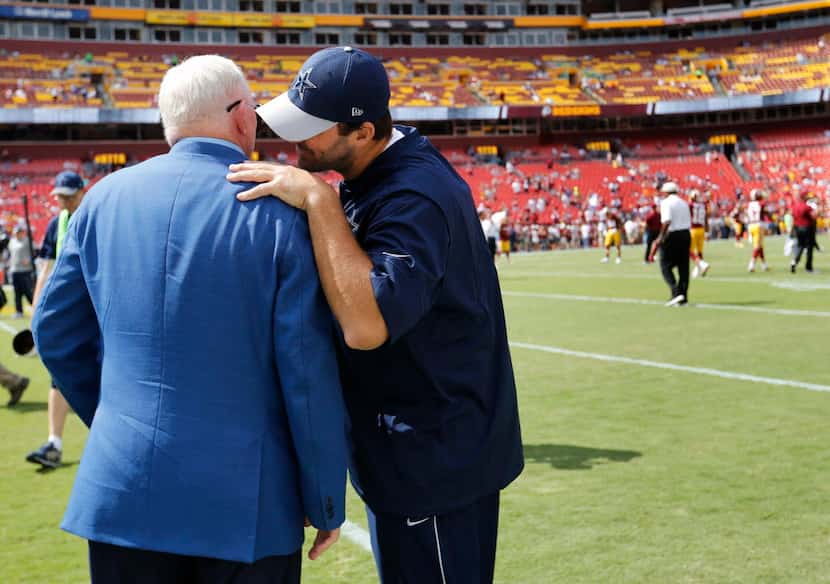Dallas Cowboys quarterback Tony Romo (9) talks to Dallas Cowboys owner and general manager...