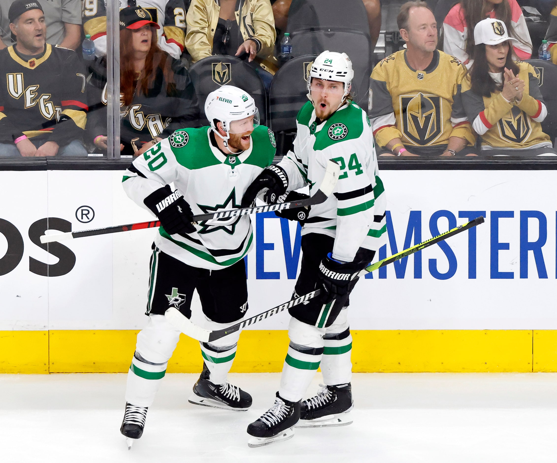 Dallas Stars center Roope Hintz (24) is congratulated by defenseman Ryan Suter (20) after...