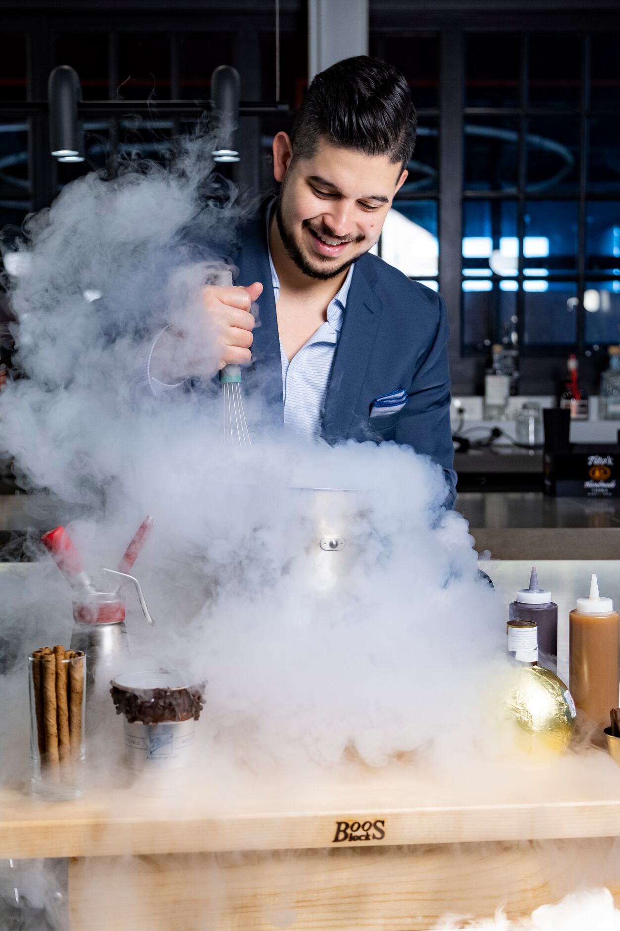Julian Rodarte, CEO of Trinity Groves and Co-Owner of Nitro Burger, uses liquid nitrogen to...