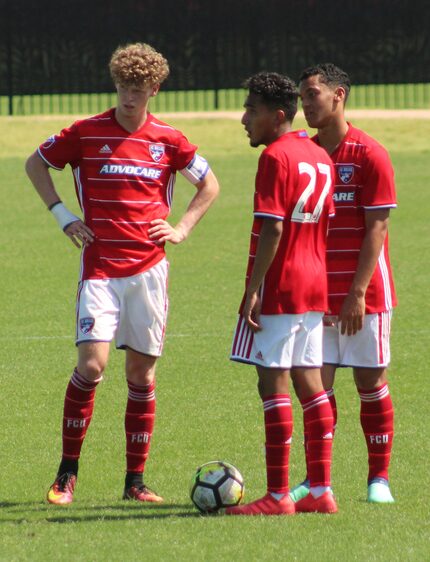 Chris Cappis (left), Jesus Ferreira (#27), and Brandon Servania (right) await a free kick...