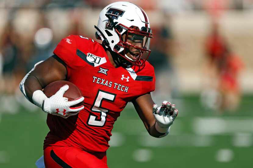 Texas Tech's Armand Shyne runs with the ball during the second half of the team's NCAA...