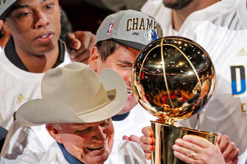 Dallas Mavericks original owner Don Carter (far left in cowboy hat) gets the Larry O'Brien...