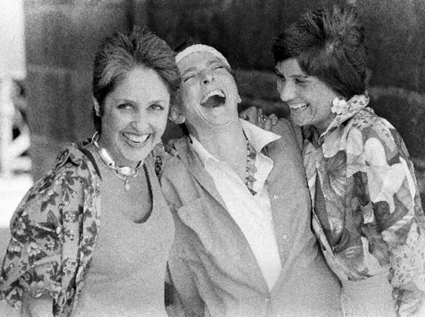 From left: Folk singers Joan Baez, Judy Collins and Mimi Farina (Baez's sister) laugh...