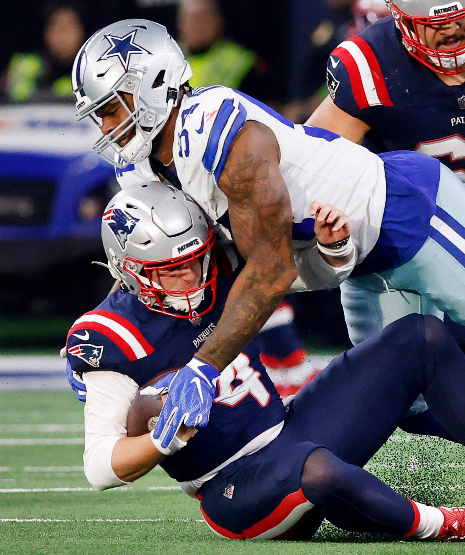 Dallas Cowboys defensive end Sam Williams (54) sacks New England Patriots quarterback Bailey...