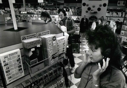 June 12, 1989: Terri McLeland checks out a new recording at Sound Warehouse on Greenville...