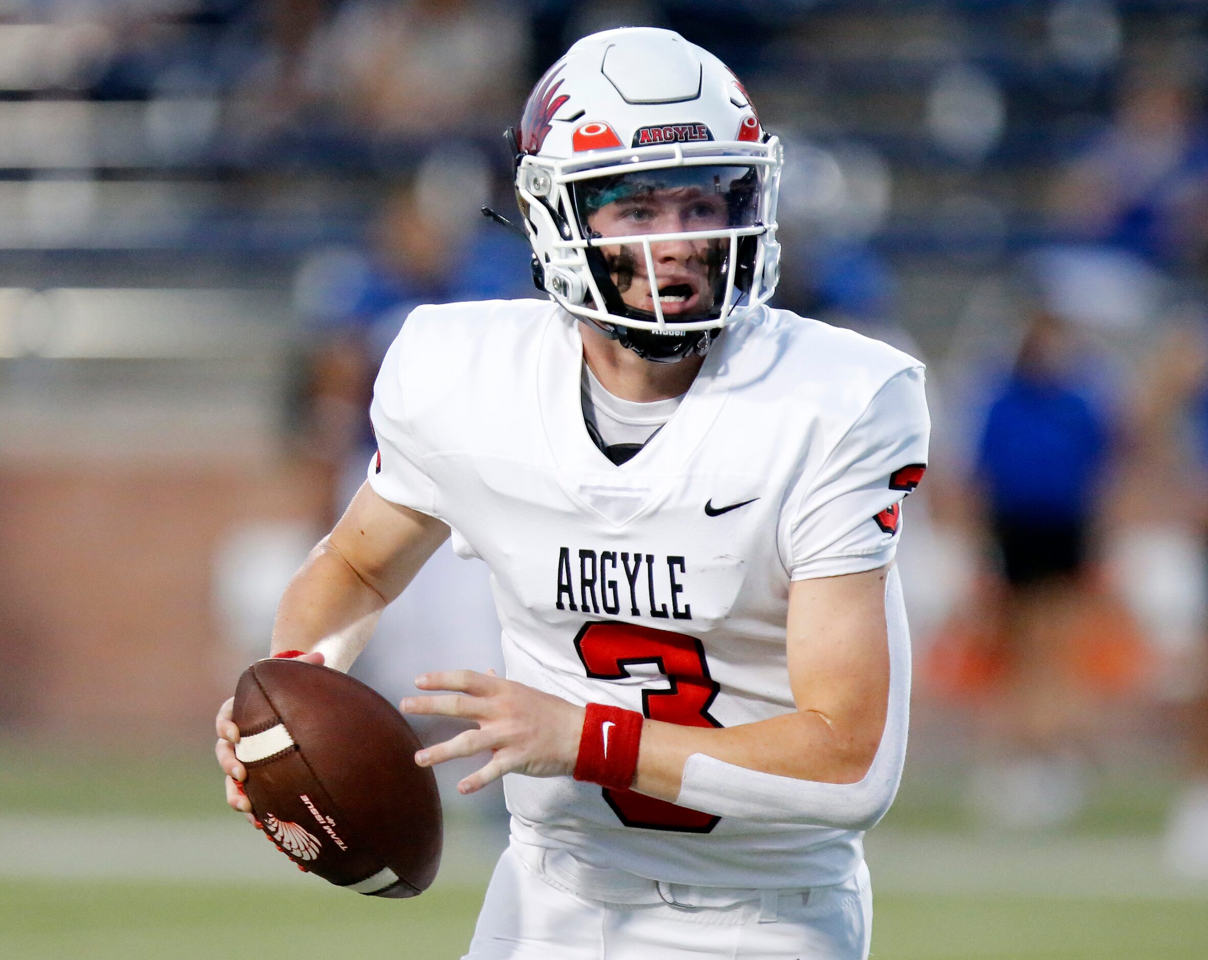 Argyle High School Jacob Robinson (3) rolls out during the first half as Argyle High School...