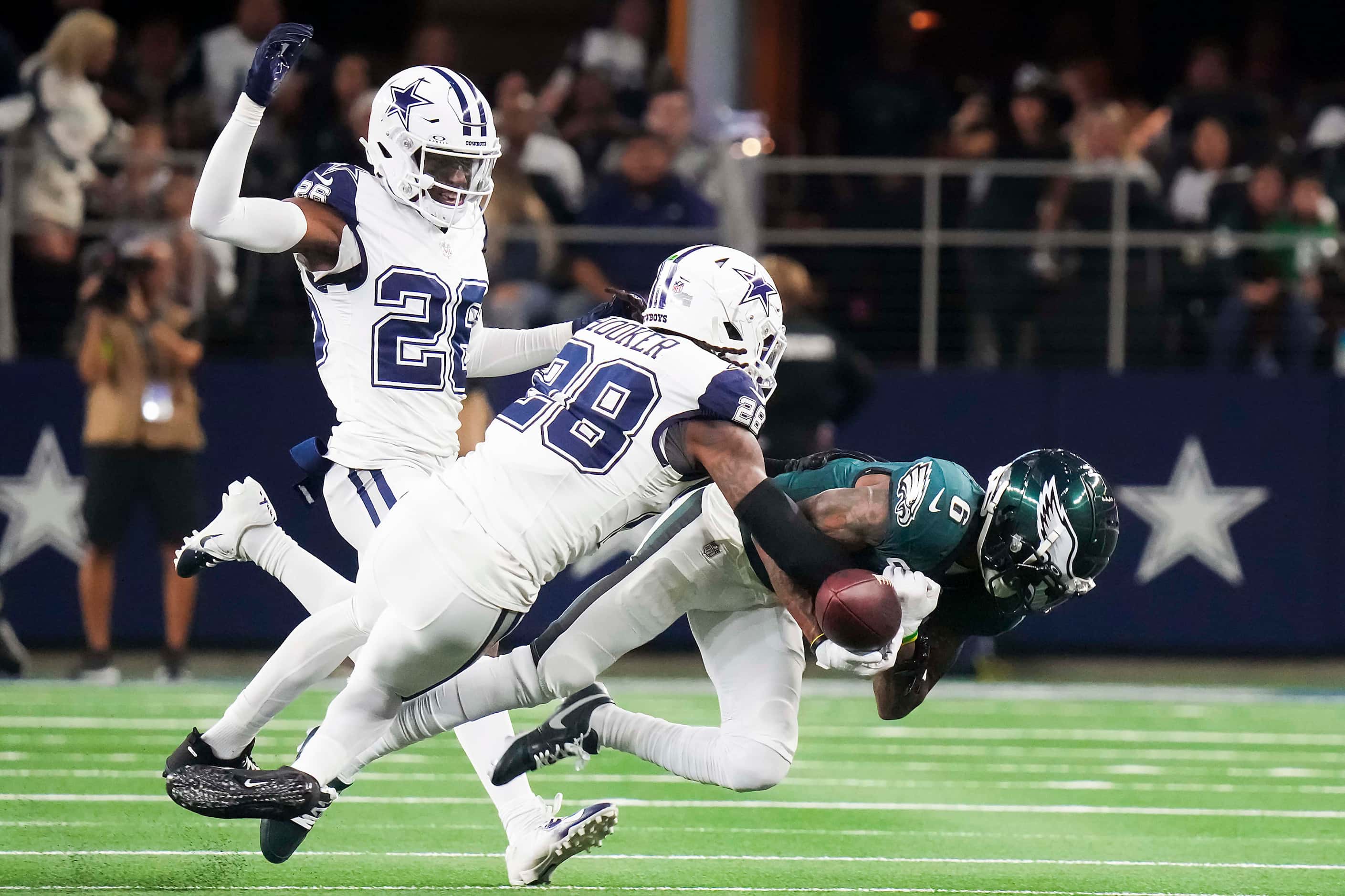 Dallas Cowboys safety Malik Hooker (28) breaks up a pass intended for Philadelphia Eagles...