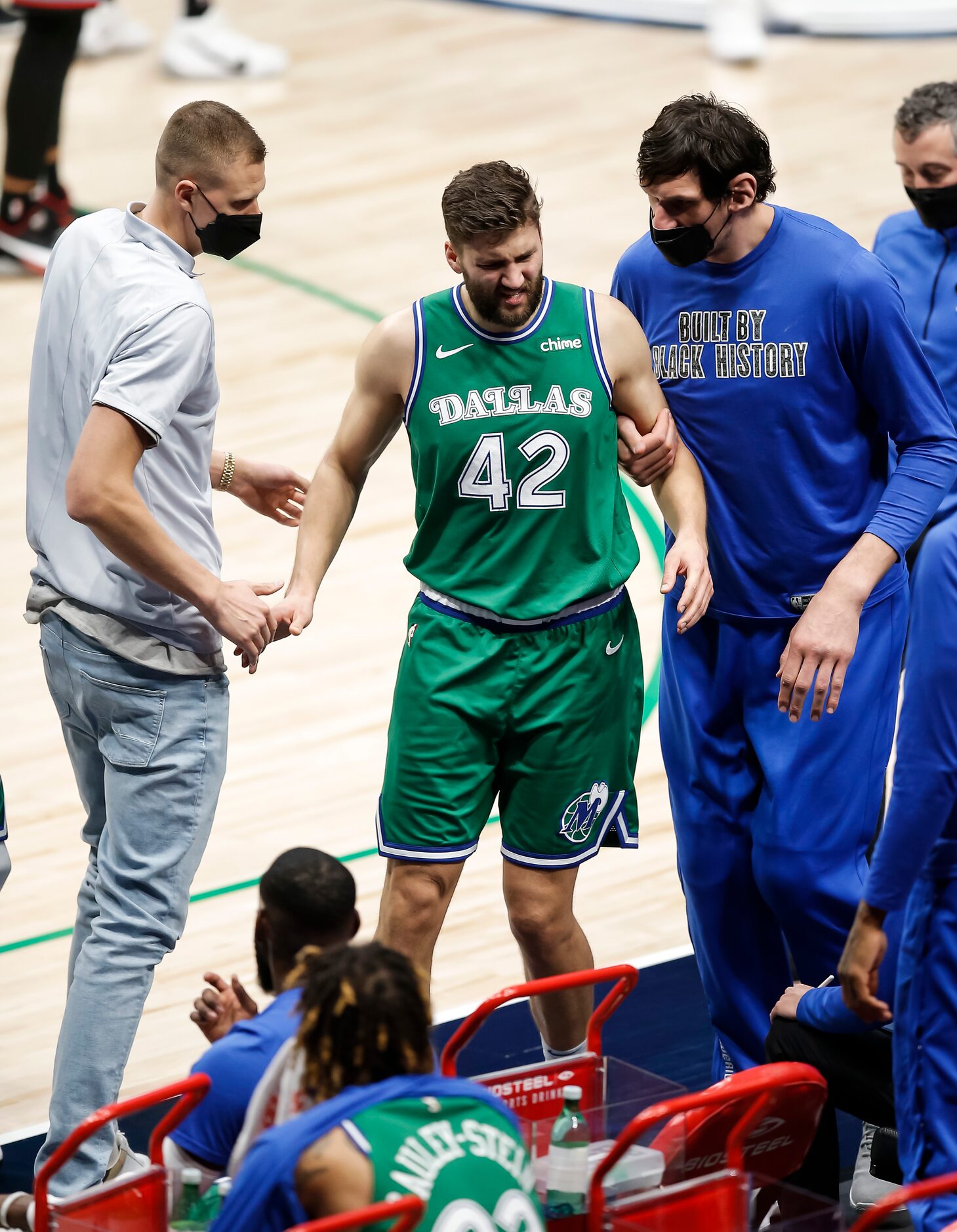 Dallas Mavericks forward Maxi Kleber (42) limps off the court during the second half of an...