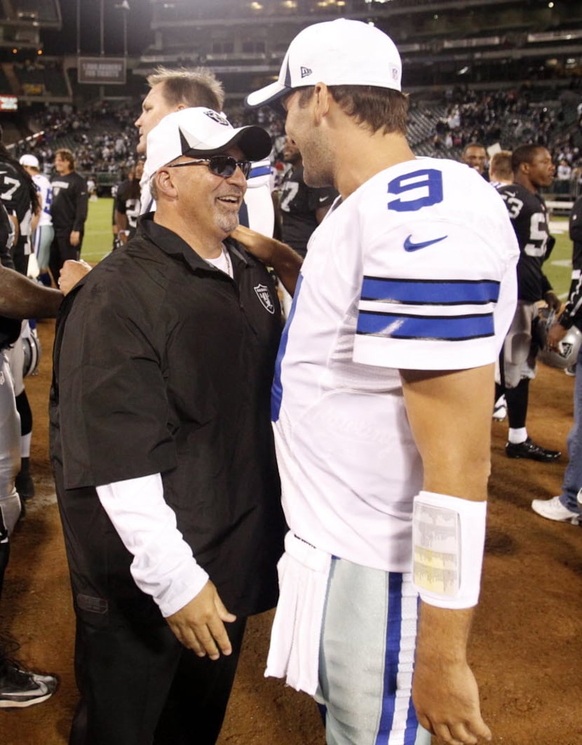 Dallas Cowboys quarterback Tony Romo (9) greets one of his former coaches and current...