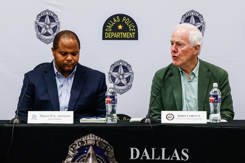 Dallas Mayor Eric Johnson, left, during a discussion panel with Texas Sen. John Cornyn about...