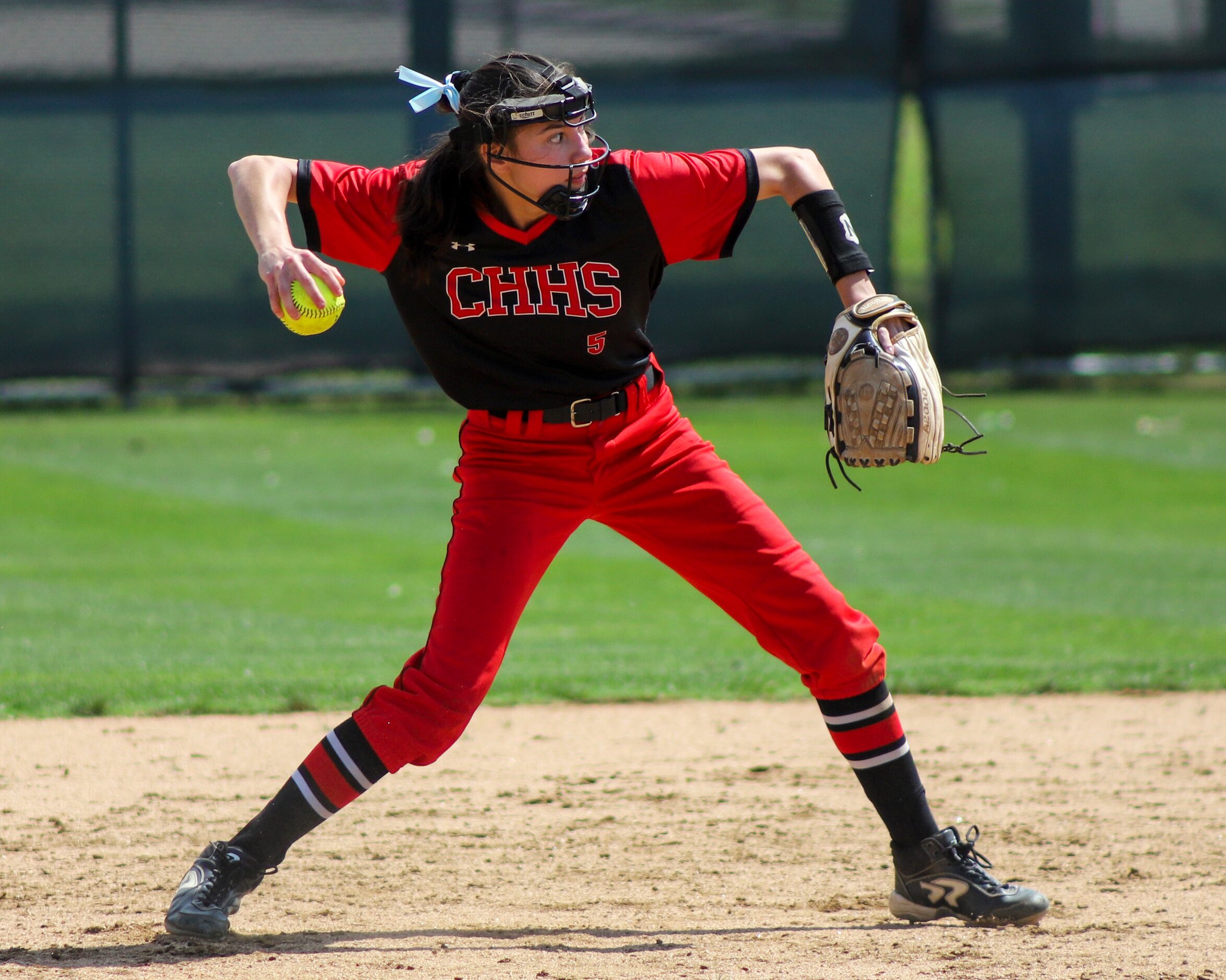 Colleyville Heritage second baseman Leah Perales (5) throws the ball during a softball Class...