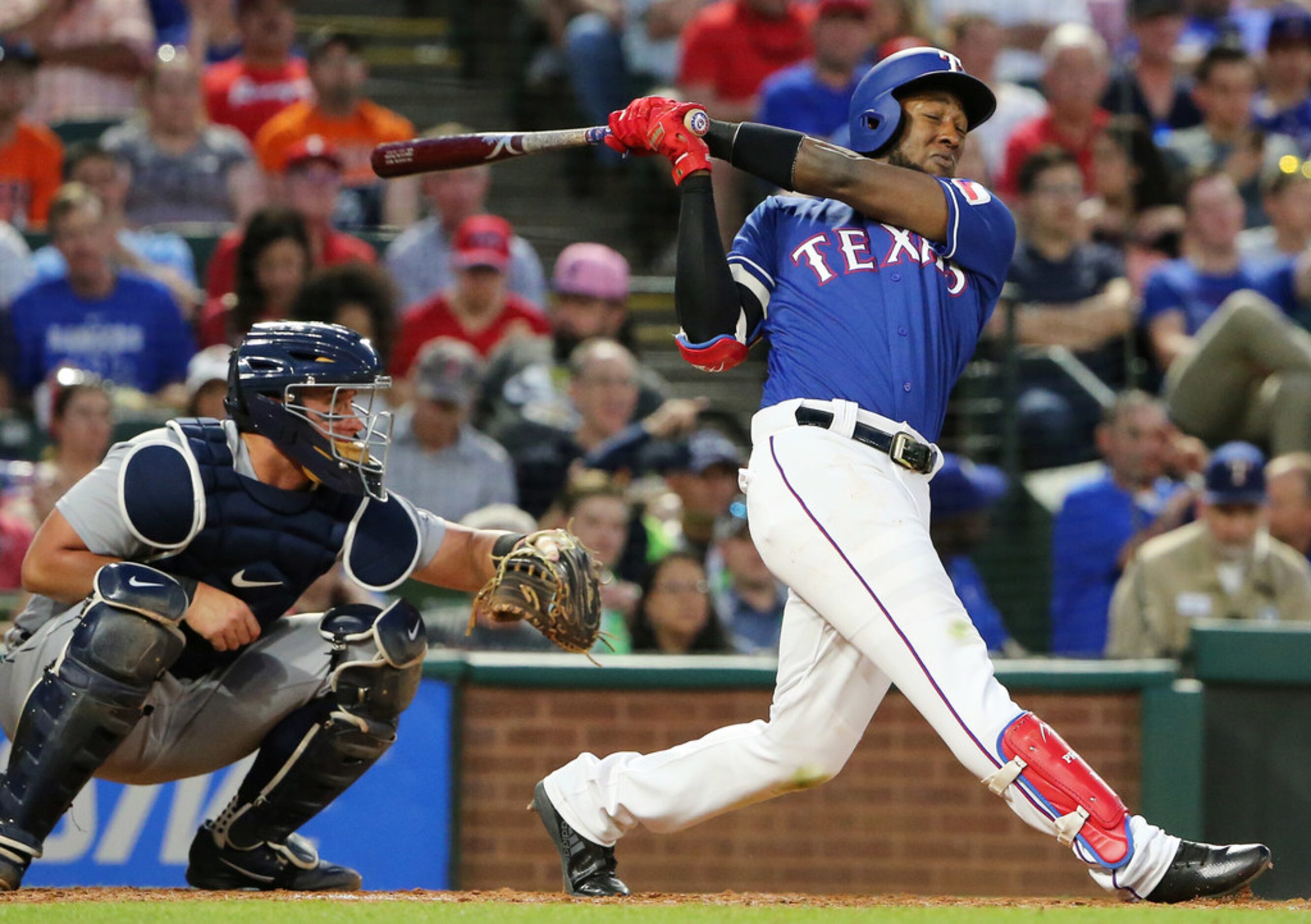 Texas Rangers shortstop Jurickson Profar (19) hits a home run to make the score 1-5 during...