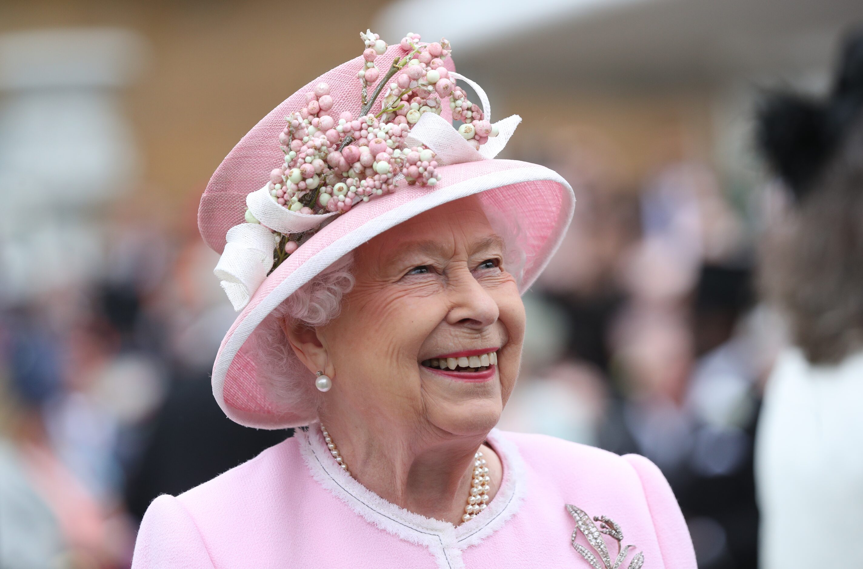 LONDON, ENGLAND - MAY 29: Queen Elizabeth II meets guests as she attends the Royal Garden...