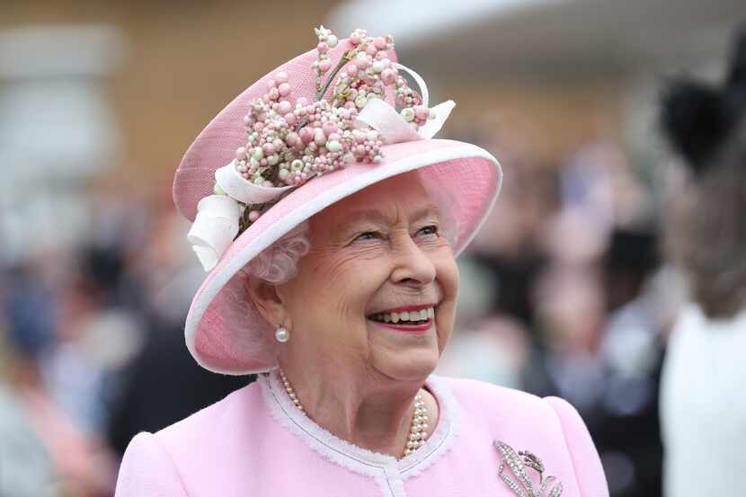 Queen Elizabeth II meets guests as she attends the Royal Garden Party at Buckingham Palace...