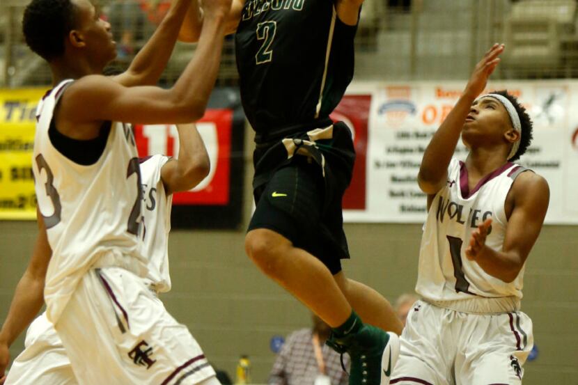 DeSoto's Brandon Butler (2) shoots against Mansfield Timberview during  the Whataburger...