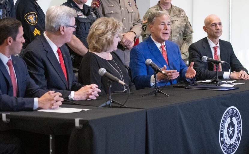 Texas Governor Greg Abbott, answers a question at a press conference where he signed HB9...