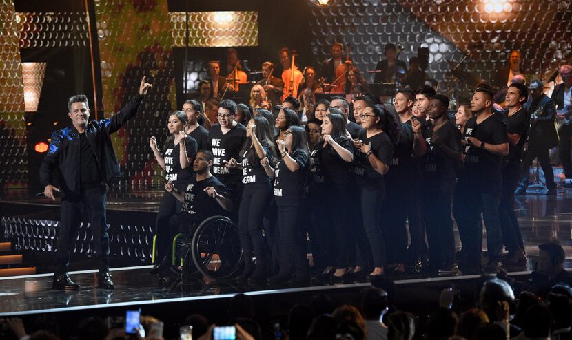 Person of the year honoree Alejandro Sanz performs with dreamers at the 18th annual Latin...