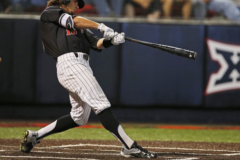 Texas Tech's Tyler Neslony hits a three-run home run against East Carolina during an NCAA...