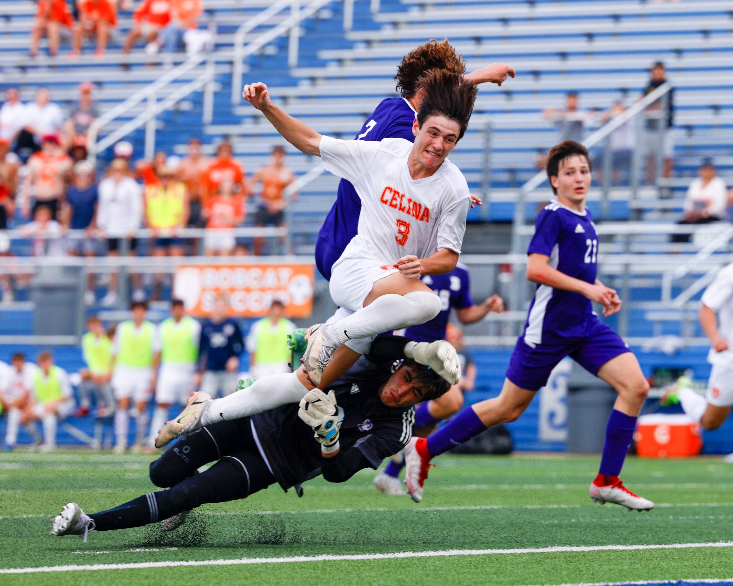 Boerne goalkeeper Noah LeMaster (0) collides with Celina forward Josten Watkins (3) after...