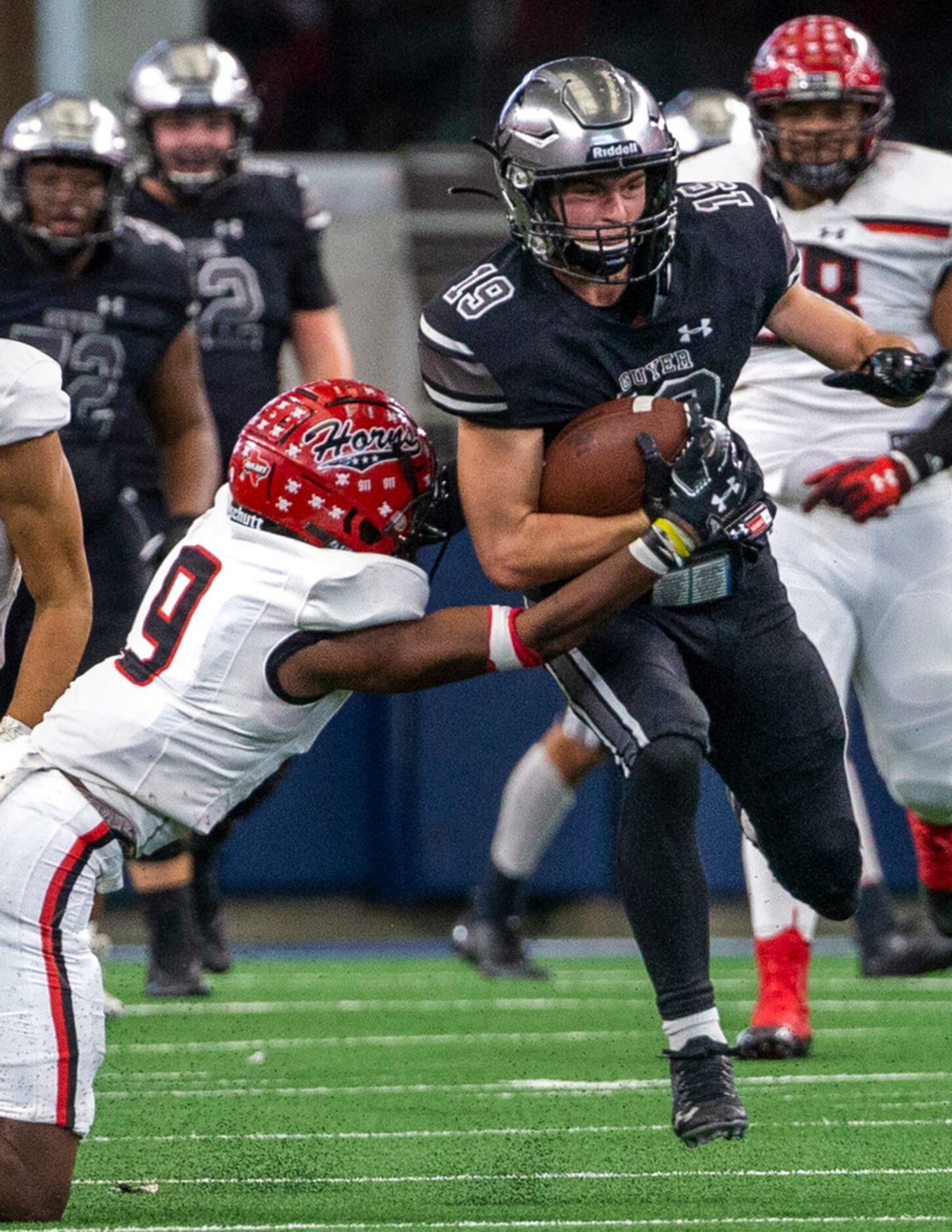 Denton Guyer wide receiver Seth Meador (19) tries to break past Cedar Hill corner back...