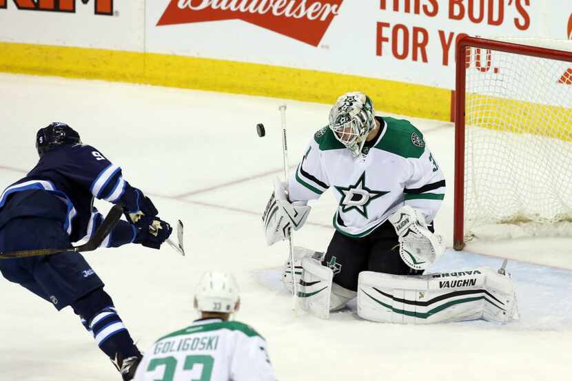 Feb 2, 2016; Winnipeg, Manitoba, CAN; Winnipeg Jets defenseman Jacob Trouba (8) is stopped...