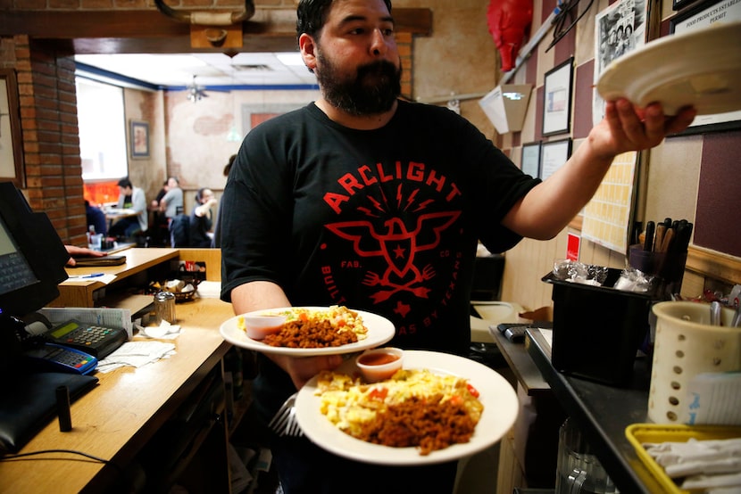 George Sanchez, a nephew of owner George Sanchez Sr., grabs an order at the Gold Rush Cafe...