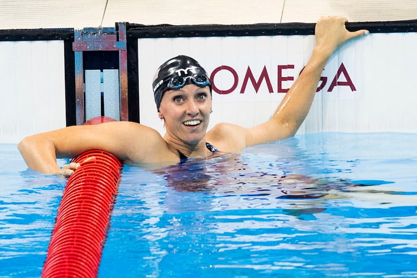 Dana Vollmer of the United States looks back for her time after swimming to a bronze medal...