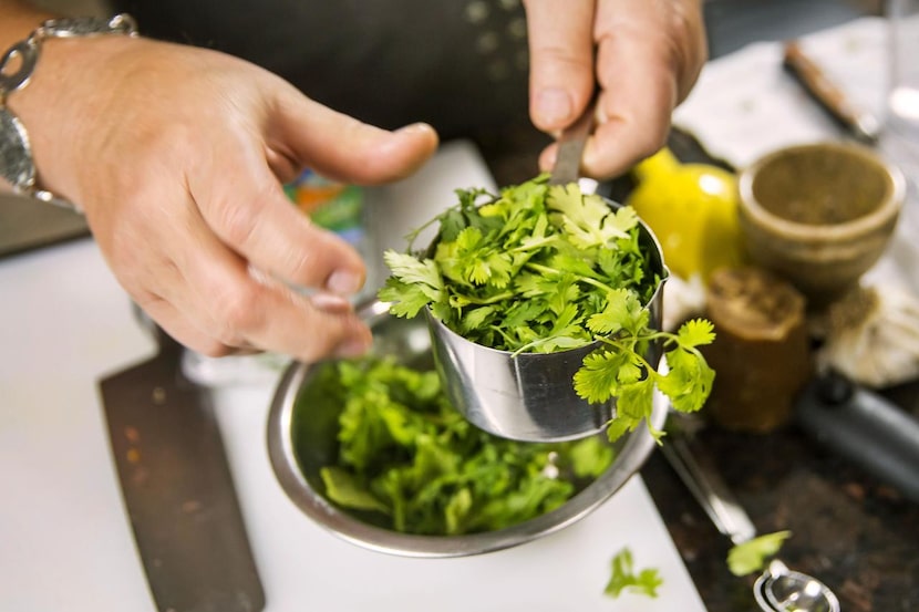 Monica preps the cilantro dressing.