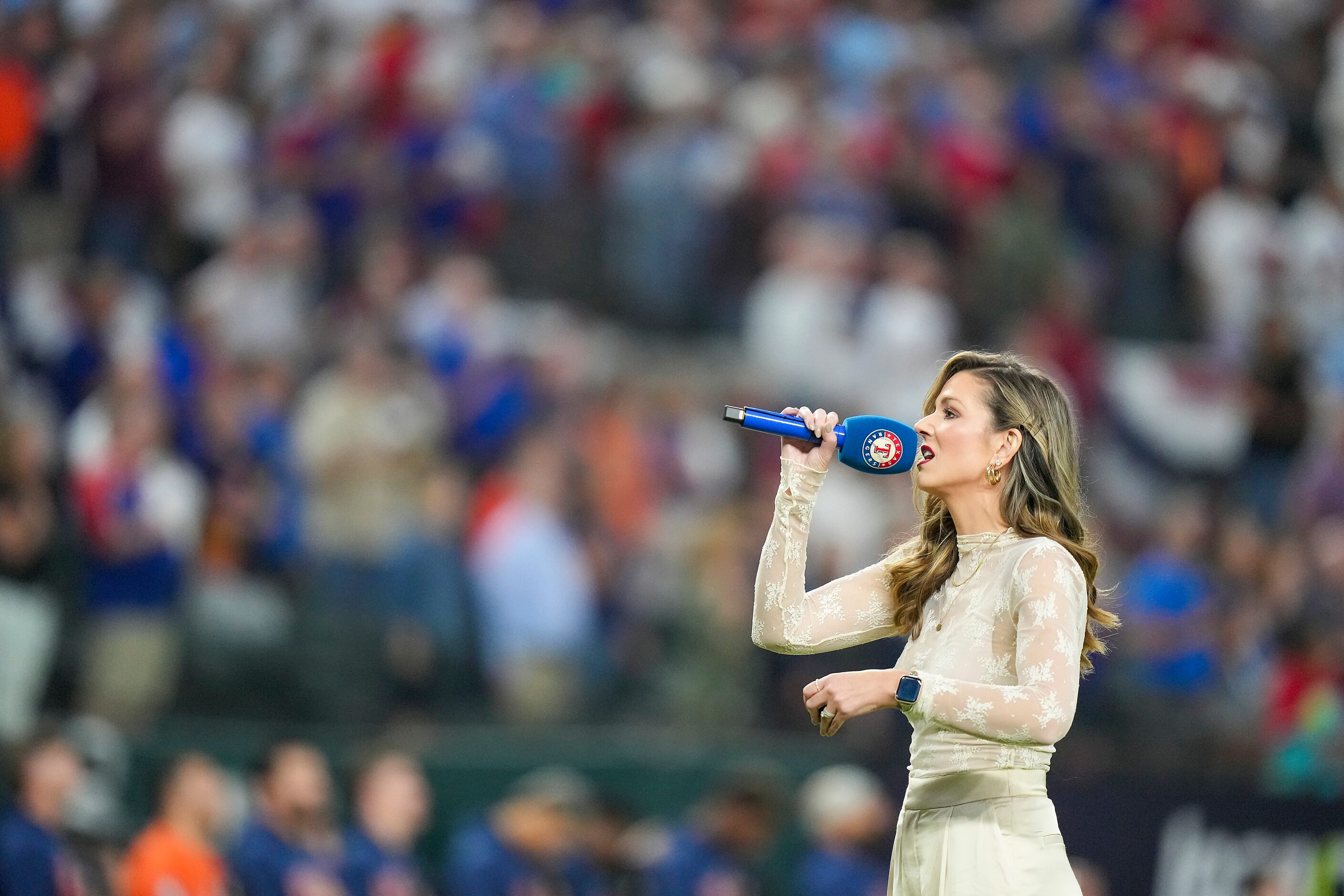 Lauren Hedricks sings the national anthem prior to  Game 4 of the American League...