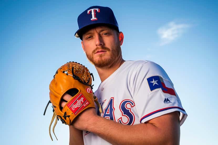 Texas Rangers pitcher Shelby Miller poses for a photograph during spring training photo day...