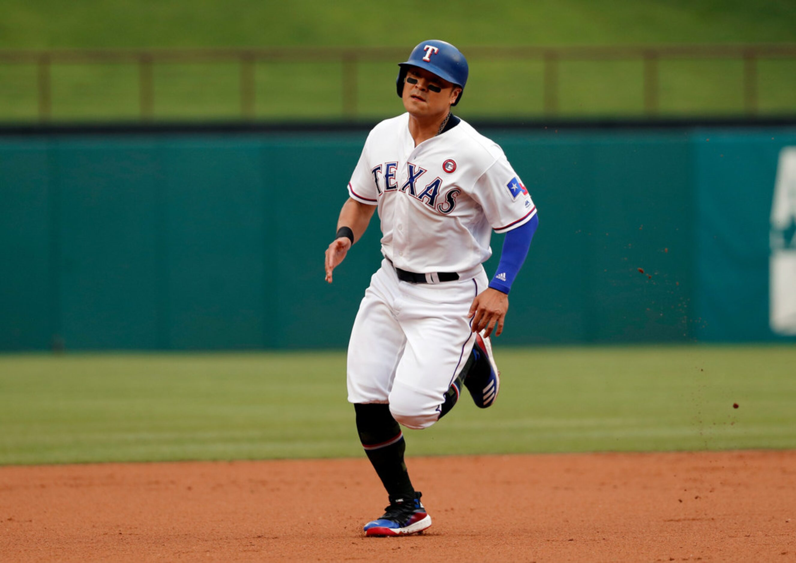 Texas Rangers' Shin-Soo Choo advances to third on a single by Willie Calhoun in the first...