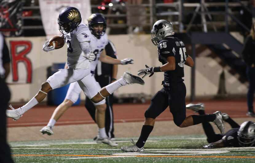 Keller Timber Creek's Erik Ezukanma, 13, high steps into the end zone for his touchdown...