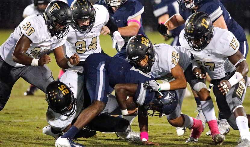 Lone Star High School wide receiver Marvin Mims (18) is brought down by The Colony High...