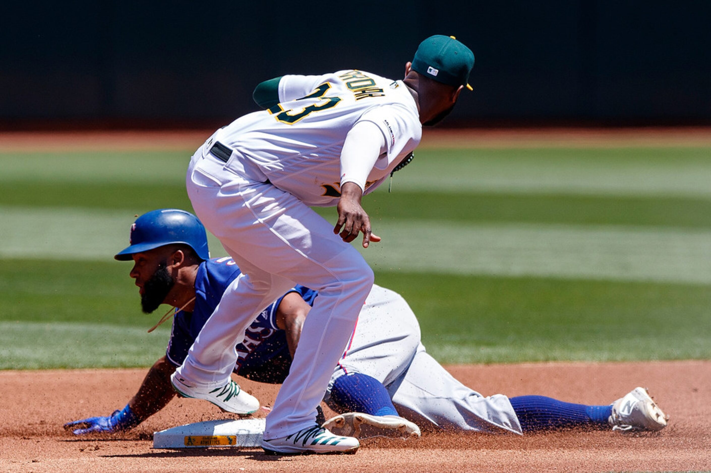 Danny Santana (38) of the Texas Rangers is tagged out attempting to steal second base by...