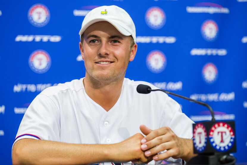 Pro golfer Jordan Spieth answers media questions during a press conference after he threw...